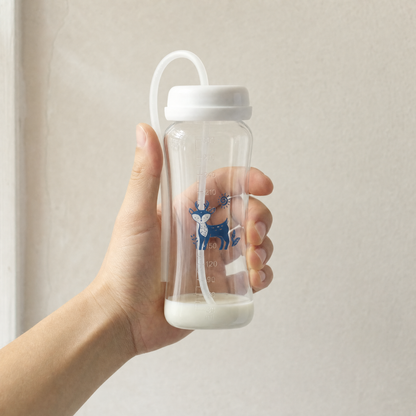 Adult hand holding the EasySip bottle to show its size